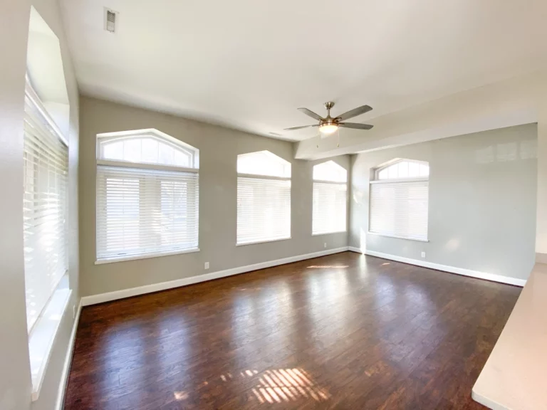 Photograph of livingroom with wood floors.
